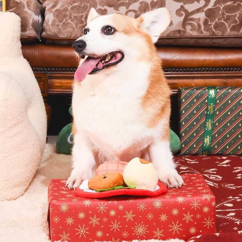 Get your dog ready for a festive feast with our Dog Snuffle Mat Christmas Dinner.  This toy includes all the trimmings, a turkey leg, ham and a fluffy mashed potato. The mini snuffle mat takes playtime to the next level, offering a nosework game for your pooch. Hide some treats in the mat and watch your dog sniff out those delicious surprises. 