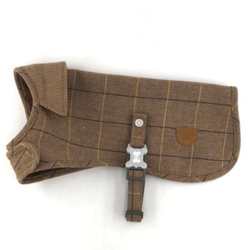 This classic caramel checked tweed dog coat is perfect to keep your dog cosy and warm on a crisp winters day.