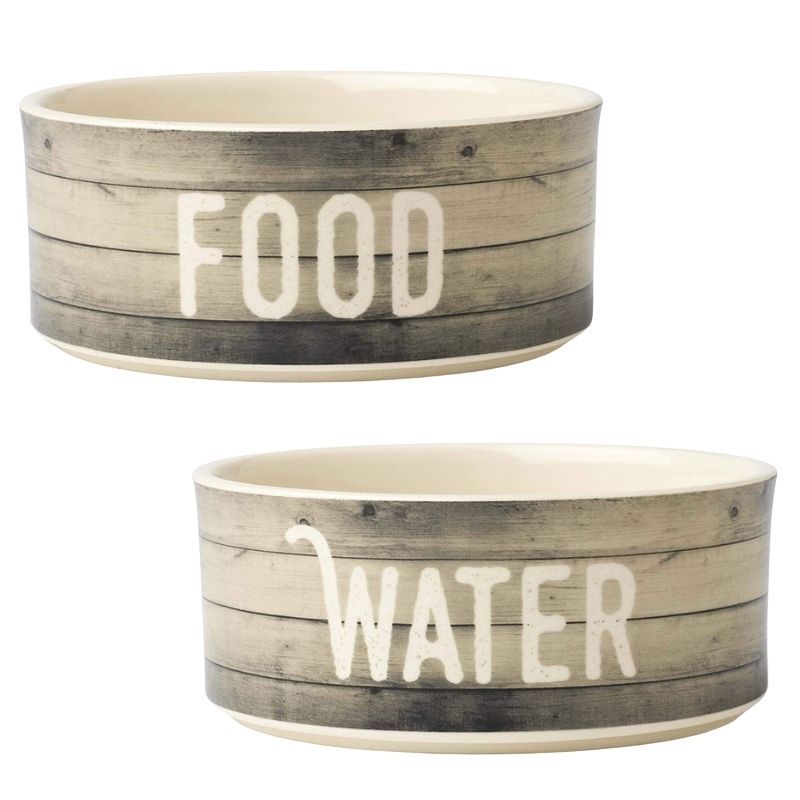 Farmhouse Dog Bowls .The Farmhouse Dog Bowls have the word FOOD and WATER detailed on the exterior. The interior features a cute bone-shaped design. These bowls would suit a traditional country kitchen with their rustic wood design.
