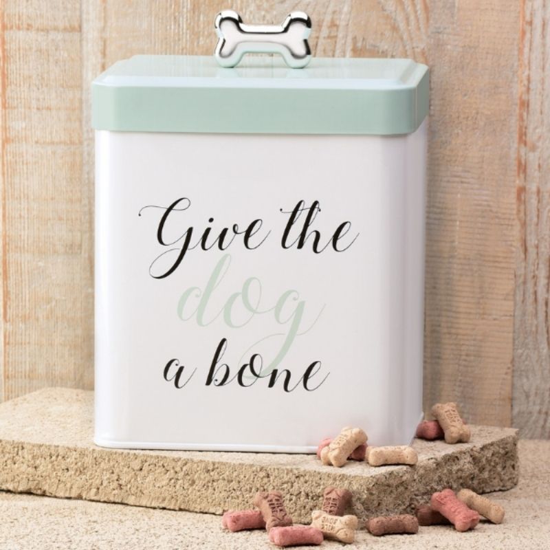 The Give the Dog a Bone Treat Tin features decorative lettering and a push top lid and a silver bone shaped handle.