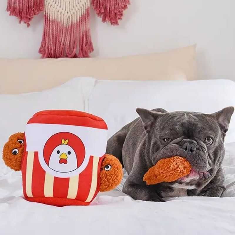Serve up playtime with our Fried Chicken Burrow Plush Dog Toy. Let your pet try to figure out how to remove these three squeaky fried chicken drumsticks