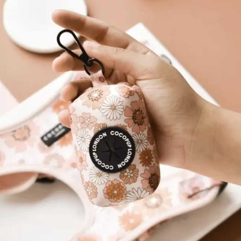 This Groovy Florals Poop Bag Holder is a super cute dog-walking accessory. Picking up poo isn't the most pleasant job but having stylish accessories on your dog walk does help. 